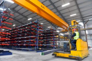 Side Loader Forklift Truck in moving in a factory