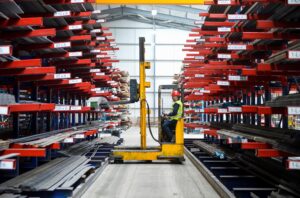Side Loader Forklift Truck in moving in a factory