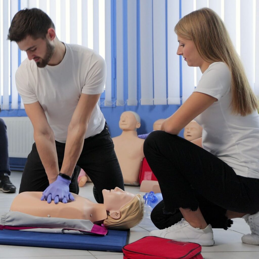 NUCO first aid trainer demonstrating to an delegate on a Emergency First Aid Training