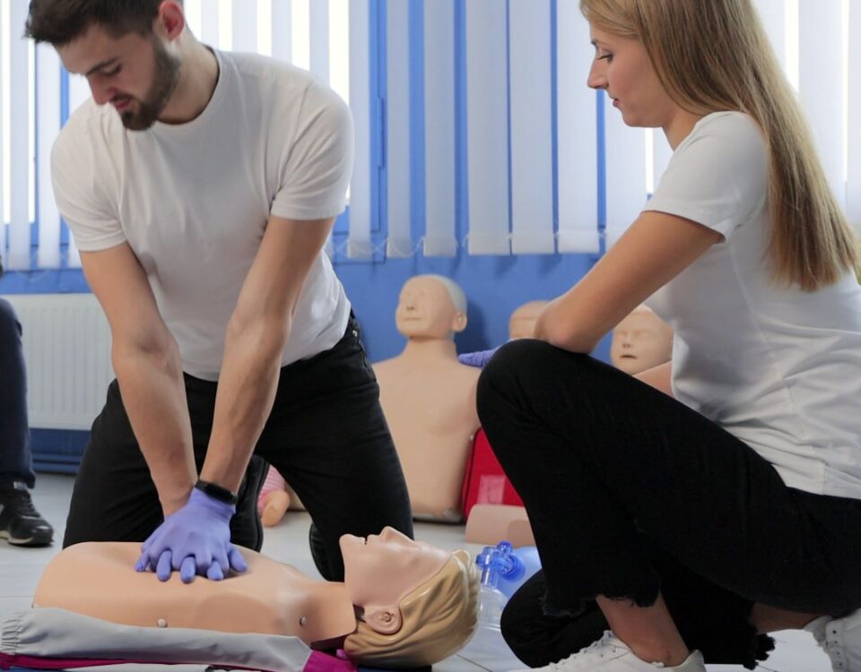 NUCO first aid trainer demonstrating to an delegate on a Emergency First Aid Training