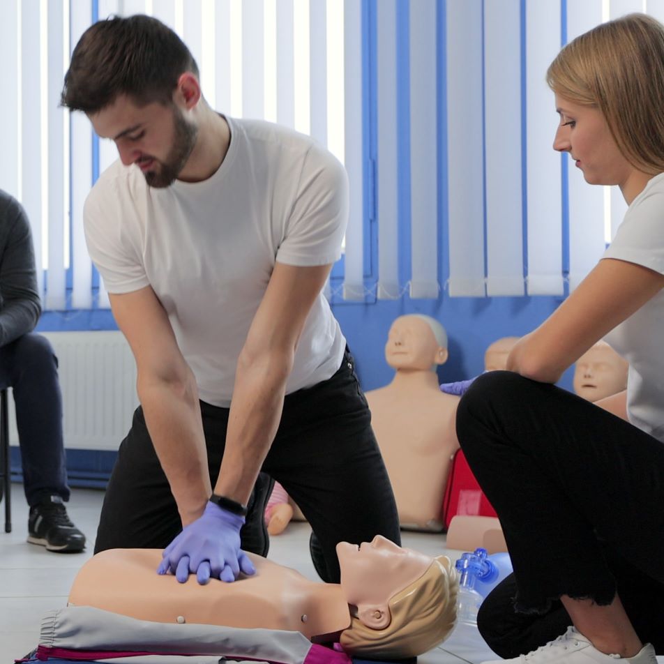 NUCO first aid trainer demonstrating to an delegate on a First Aid at Work course.