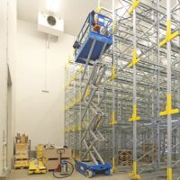 Scissor Lift Training Scissor lift in a warehouse used for training