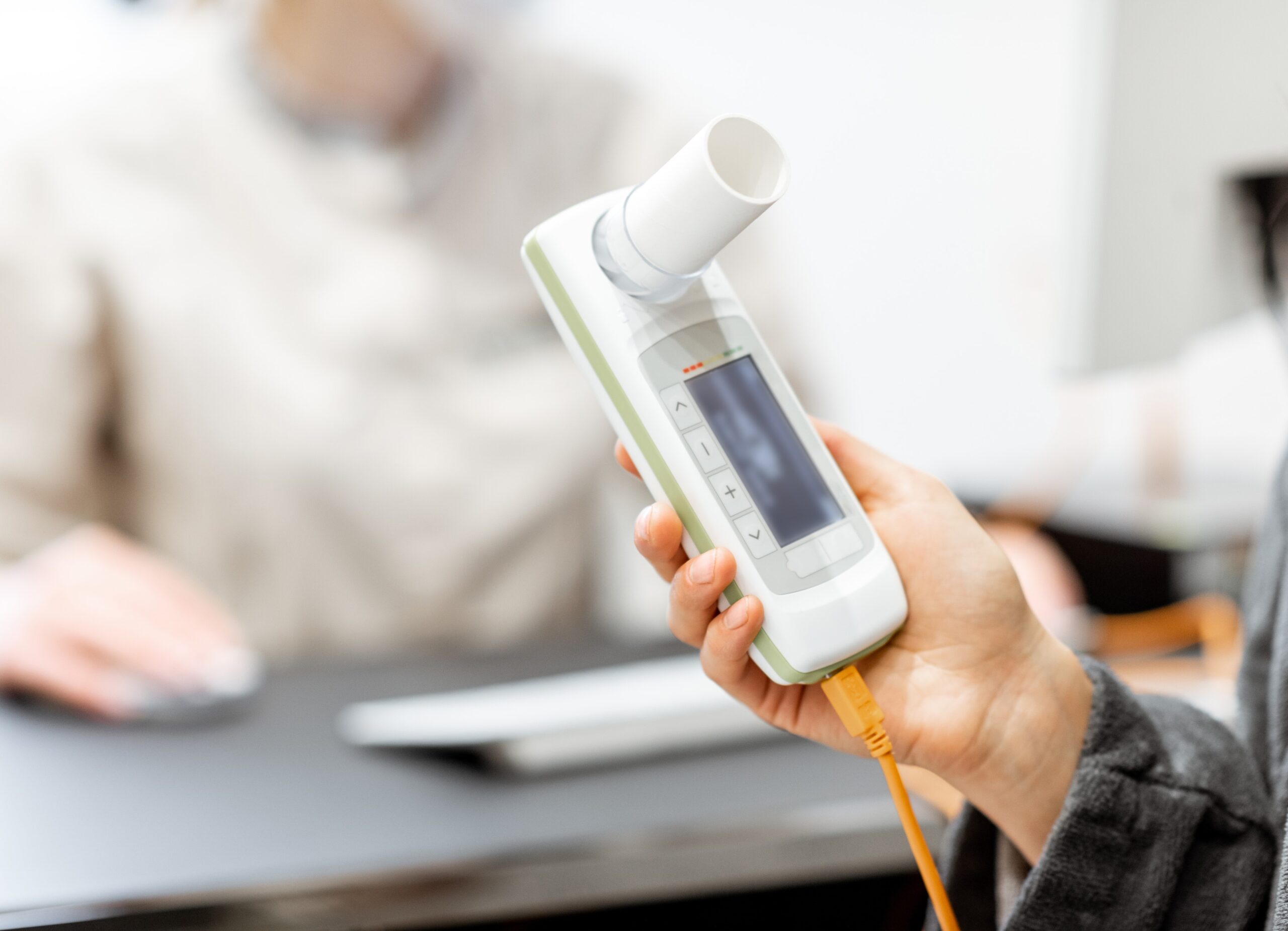 A woman having lung function testing