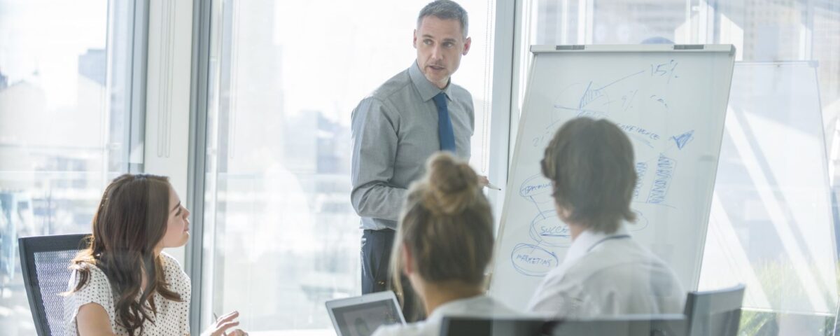 A Trainer running IOSH training course for delegates at a company