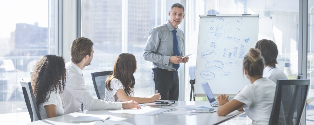 A Trainer running IOSH training course for delegates at a company