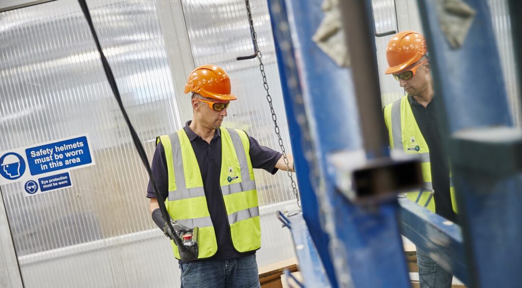 Worker using and Overhead Crane following training