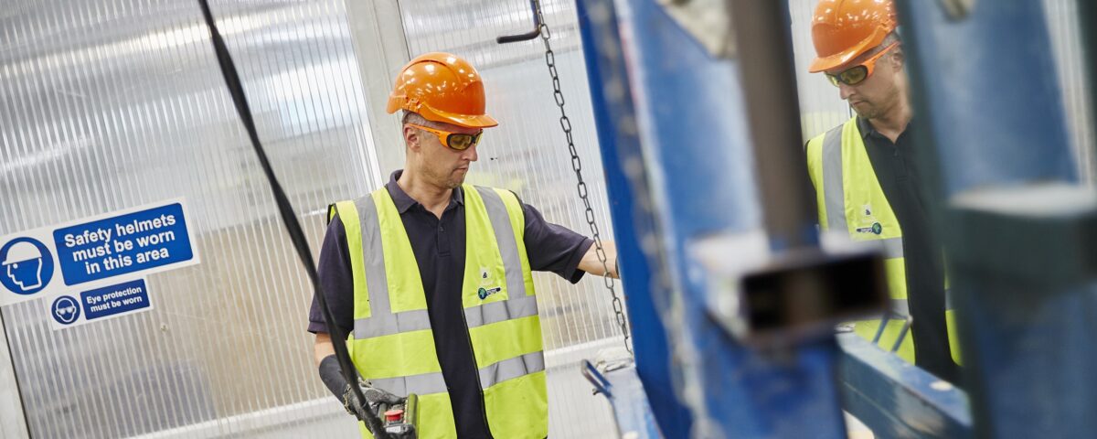 Worker using and Overhead Crane following training