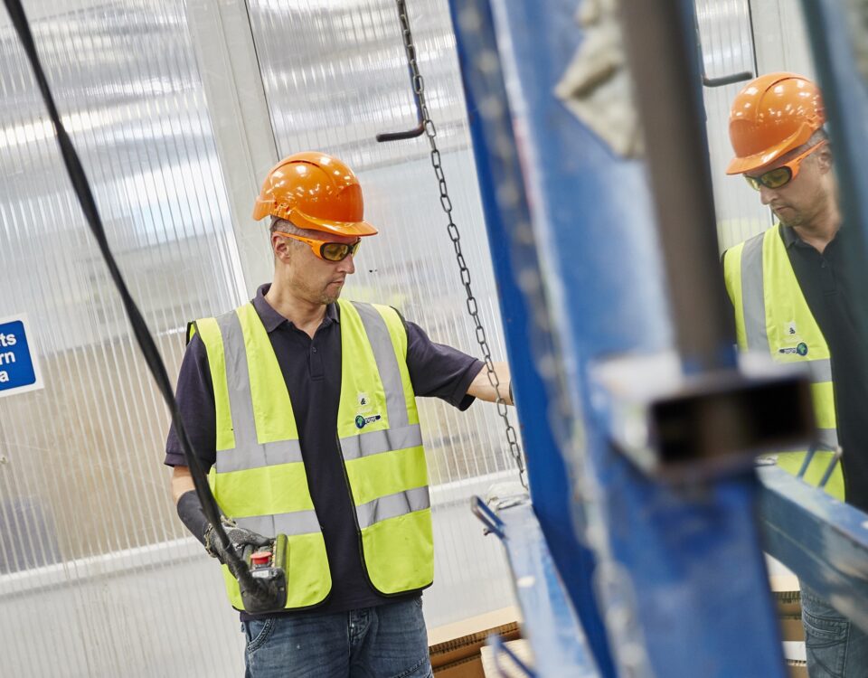 Worker using and Overhead Crane following training