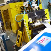 An employee using a Power Press following the training course in Norfolk
