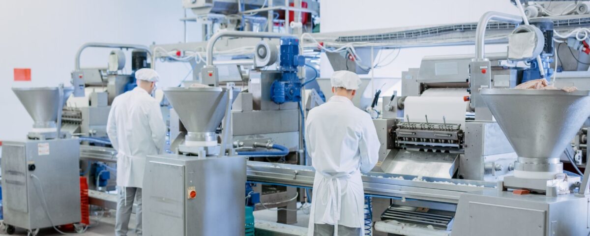 Employees working in a Food factory following SPA food and drink training