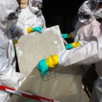 Workers clearing asbestos following Asbestos Awareness Training