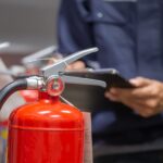 Employee conducting a fire risk assessment